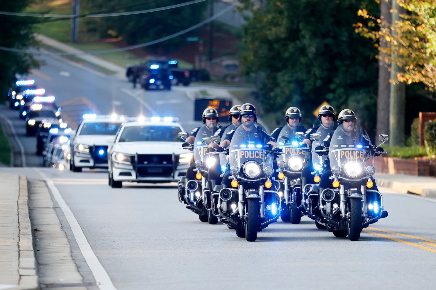 A motorcade leads the caravan where the hearse of the fallen Deputy Jonathan Koleski is being transported to the NorthStar church for his funeral service on Wednesday, September 14, 2022. Wednesday, September 14, 2022. Miguel Martinez / miguel.martinezjimenez@ajc.com