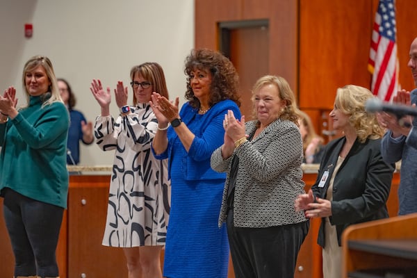 Cherokee County School District School board members give applause as students receive recognition during a school board meeting on Thursday, February 15, 2024. The school board voted 4-3 during the meeting to hire Henry County School District Mary Elizabeth Davis as its next superintendent. (Atlanta Journal-Constitution/Jason Allen)