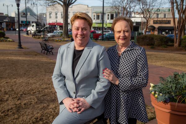 Portrait of Patsy Bryan with her daughter, Dr. Charity Bryan, an associate professor at Kennesaw State University at the Marietta Square in Marietta. Patsy Bryan of Marietta founded the nonprofit 10 Women of Hope to give financial assistance to single moms in Cobb County. As a single mom herself, Bryan knows the struggles they face. She often took on extra jobs to make ends meet. (Phil Skinner for The Atlanta Journal-Constitution)