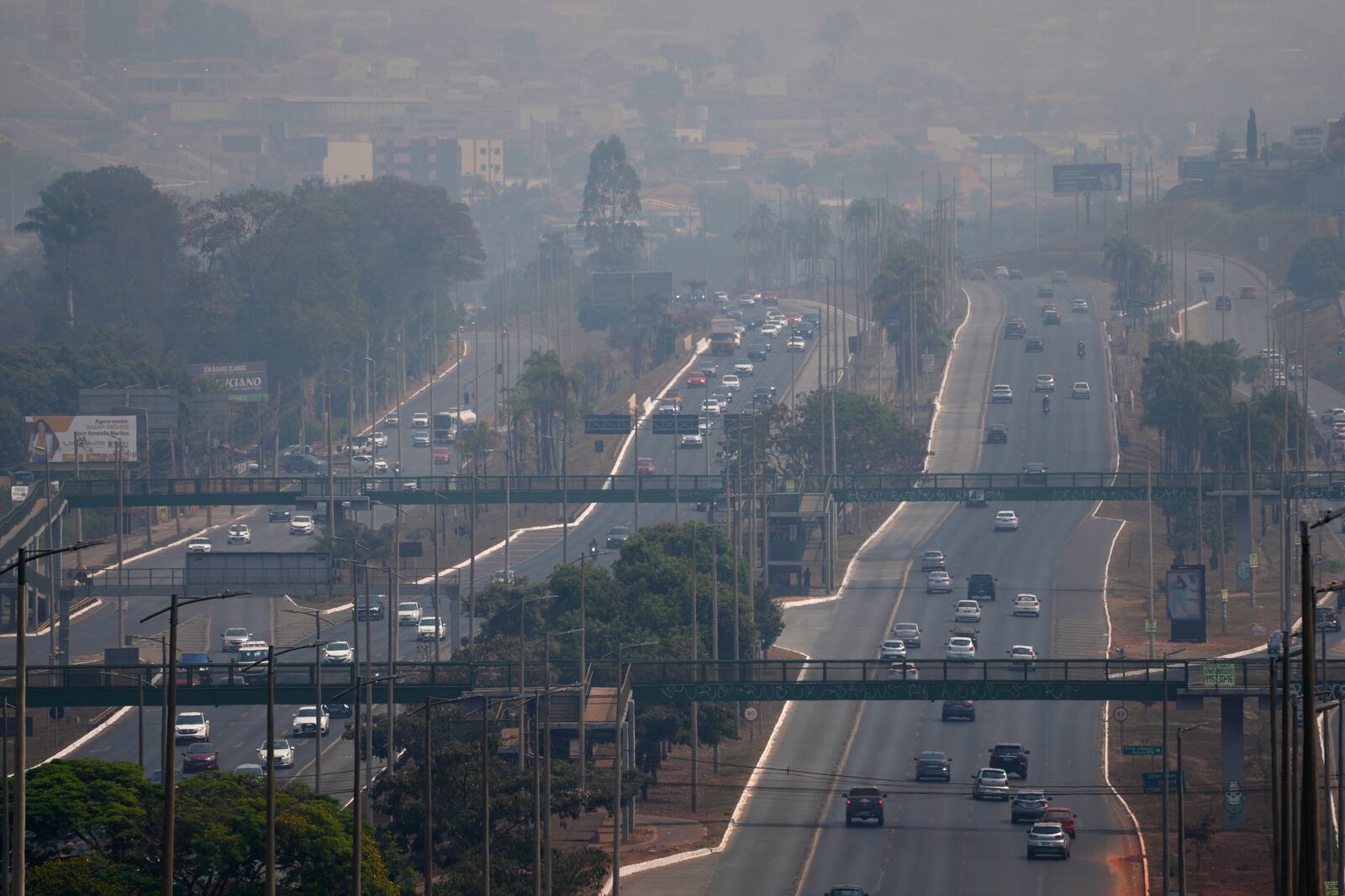 FILE - Smoke stemming from nearby wildfires and dry weather covers Park Way in Brasilia, Brazil, Aug. 25, 2024. (AP Photo/Eraldo Peres, File)