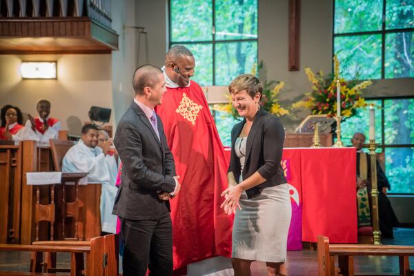 The Rev. Charles L. Fischer III welcomes St. Paul’s new Minister of Music Will Buthod and his wife, Verena Anders, at the church’s Homecoming Celebration/136th Anniversary service held recently. St. Paul’s is the old African-American Episcopal church in Georgia. CONTRIBUTED BY RAEVAUGHN LUCAS