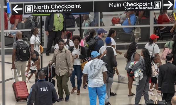 Airport customer service workers move travelers through the North side of the domestic terminal on Friday, Aug. 30, 2024, as the last hurrah of the summer saw yet another packed weekend at Hartsfield-Jackson International Airport. (John Spink/AJC)