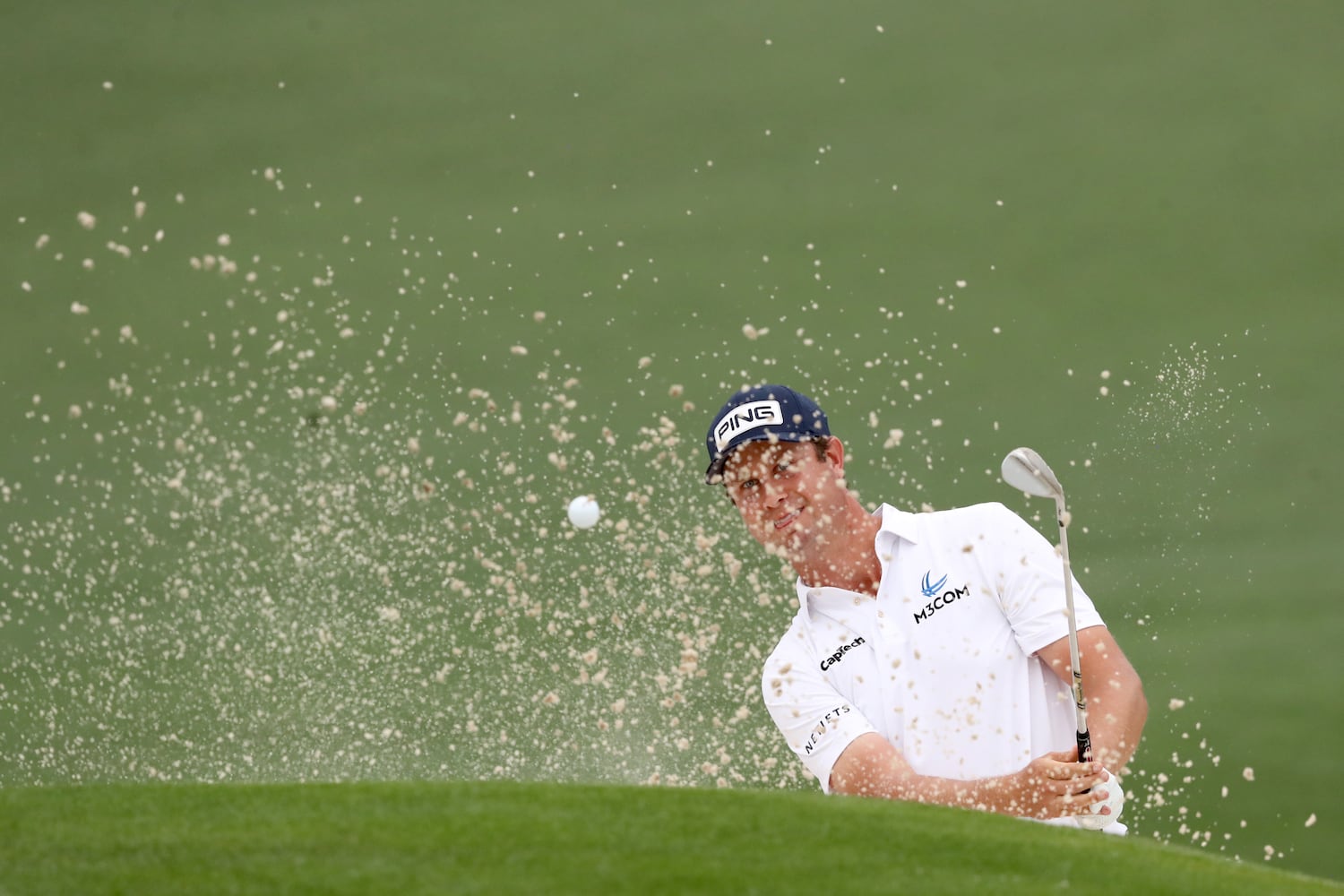 April 10, 2021, Augusta: Harris English hits out of the bunker on the second hole during the third round of the Masters at Augusta National Golf Club on Saturday, April 10, 2021, in Augusta. Curtis Compton/ccompton@ajc.com