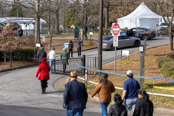 Mourners enter the Carter Center in Atlanta on Sunday, January 5, 2025. Former president Jimmy Carter, who died at 100, is lying in repose at the center. (Arvin Temkar / AJC)