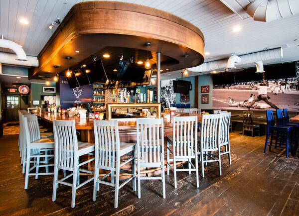 You won’t have trouble finding a TV at Irby’s Tavern in Buckhead — even at its horseshoe-shaped bar. CONTRIBUTED BY HENRI HOLLIS