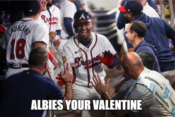 Braves second baseman Ozzie Albies celebrates a home run (and your love).