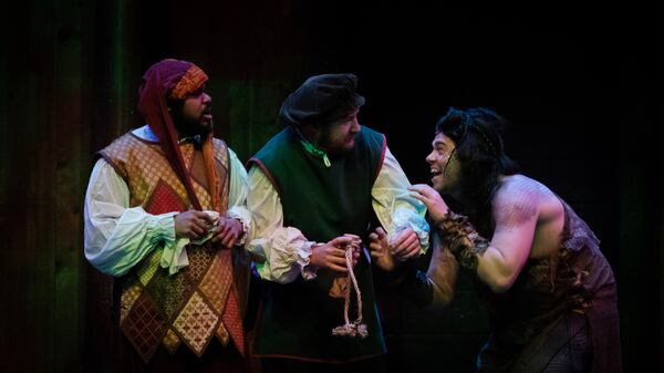 Shipwrecked Trinculo (O'Neil Delapenha, left) and Stephano (Cory Phelps) meet the deformed Caliban (Justin Walker).