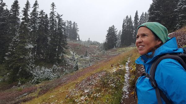 Shelly Sundberg greets sudden fall-like weather as she hikes up a trail toward Kodiak Peak in the Cascades during a day hike with her daughter from a backpacking base camp. (Rachel Alexander / The Spokesman-Review)