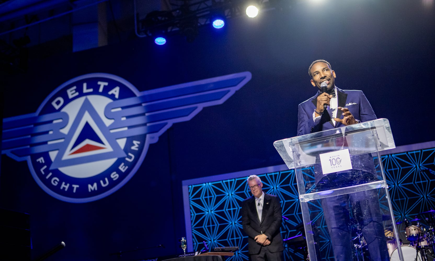 Atlanta Mayor Andre Dickens is on stage as Delta celebrates its 100 year anniversary on Saturday, March 15, 2025 at the Delta Flight Museum. (Jenni Girtman for The Atlanta Journal-Constitution)