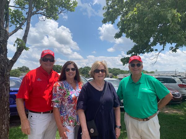 John Cherry (right), his wife Marlene, and his brother Randy Cherry, and Randy’s wife Louise wait in line a block away from the convocation center.