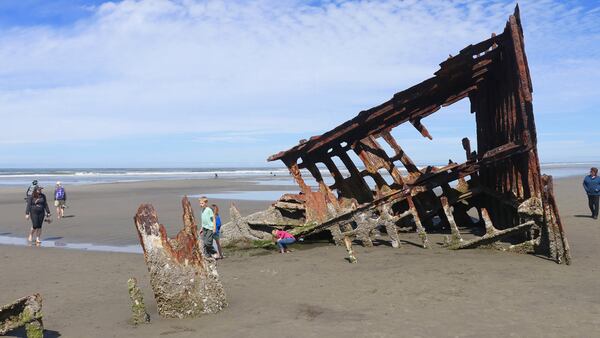 The bare bones of the Peter Iredale, a British four-masted bark that ran aground in 1906, are a magnet for beach visitors to Fort Stevens State Park. (Alex Pulaski/Chicago Tribune/TNS)