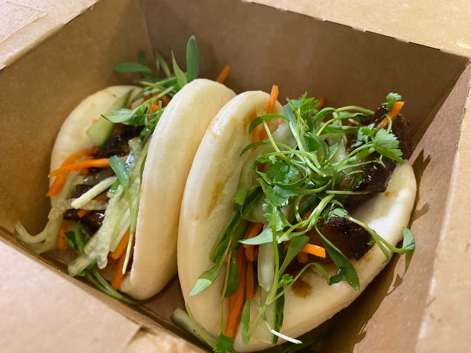 Pork bao buns are a recent addition to the Publico menu. Ligaya Figueras/ligaya.figueras@ajc.com