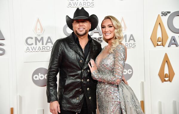 Jason Aldean, left, and Brittany Aldean arrive at the 56th Annual CMA Awards on Wednesday, Nov. 9, 2022, at the Bridgestone Arena in Nashville, Tenn. (Photo by Evan Agostini/Invision/AP)