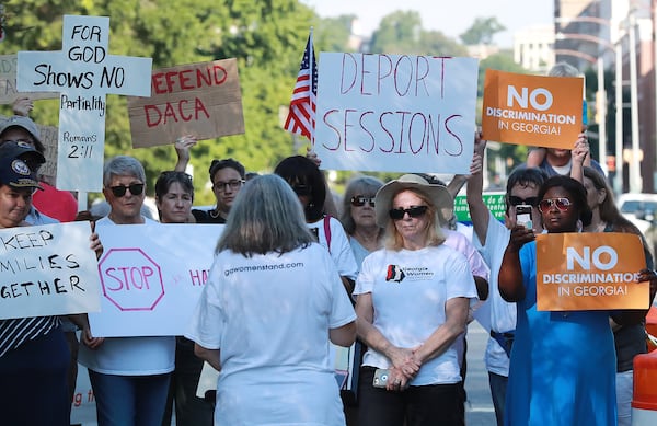 August 9, 2018, Macon: Several dozen protesters gather across the street from the United Sates Attorney's Office for the Middle District of Georgia during a visit by Attorney General Jeff Sessions on Thursday, August 9, 2018, in Macon.  Curtis Compton/ccompton@ajc.com