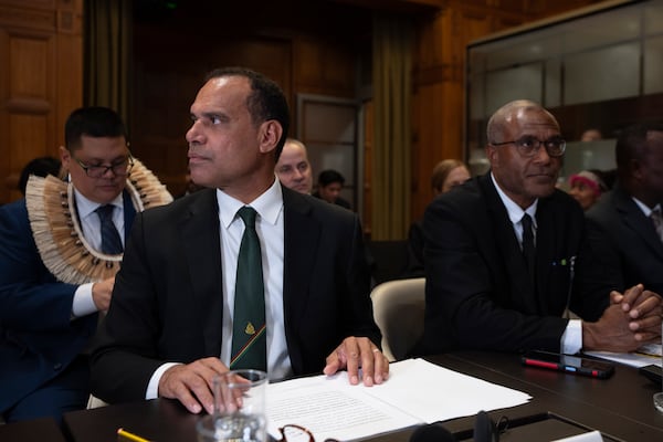 Vanuatu's special climate envoy Ralph Regenvanu prepares to speak as the International Court of Justice in The Hague, Netherlands, opens hearings into what countries worldwide are legally required to do to combat climate change and help vulnerable nations fight its devastating impact, Monday, Dec. 2, 2024. (AP Photo/Peter Dejong)