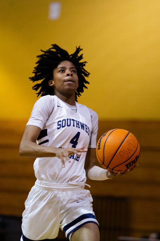 Pryia Thompson (4), guard for South Dekalb High School, goes for a layup during the South Dekalb vs. Cass girls basketball playoff game on Friday, February 26, 2021, at South Dekalb High School in Decatur, Georgia. South Dekalb defeated Cass 72-46. CHRISTINA MATACOTTA FOR THE ATLANTA JOURNAL-CONSTITUTION