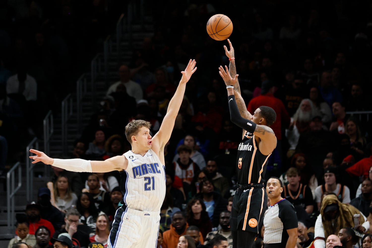 Hawks guard Dejounte Murray shoots over Magic center Moritz Wagner during the second half Monday night in Atlanta. (Miguel Martinez / miguel.martinezjimenez@ajc.com)