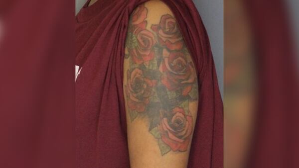 The U.S. Marshals Service is asking for the public to help them find Tamera Renee Williams, who is wanted for murdering her boyfriend. Pictured is a tattoo on Williams' arm.