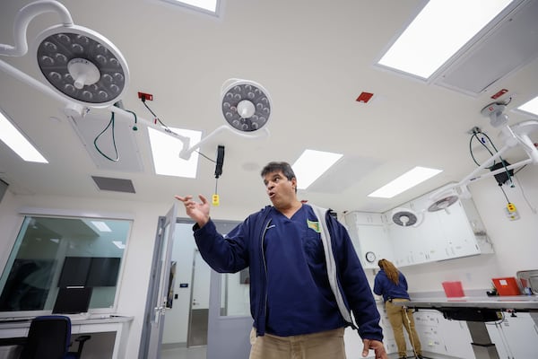 Vice President of Animal Health at Zoo Atlanta, Dr. Sam Rivera, explains the types of equipment they use at the treatment room.
(Miguel Martinez / AJC)