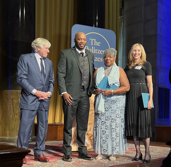 Second from left to right: Winfred Rembert Jr., Patsy Rembert and Erin I. Kelly accepting the Pulitzer Prize in 2022 for "Chasing Me to My Grave: An Artist's Memoir of the Jim Crow South."   Courtesy of Erin I. Kelly
