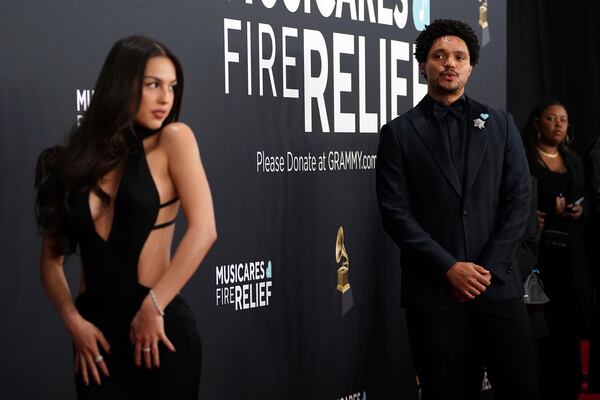 Olivia Rodrigo, left, and Trevor Noah arrive at the 67th annual Grammy Awards on Sunday, Feb. 2, 2025, in Los Angeles. (Photo by Jordan Strauss/Invision/AP)