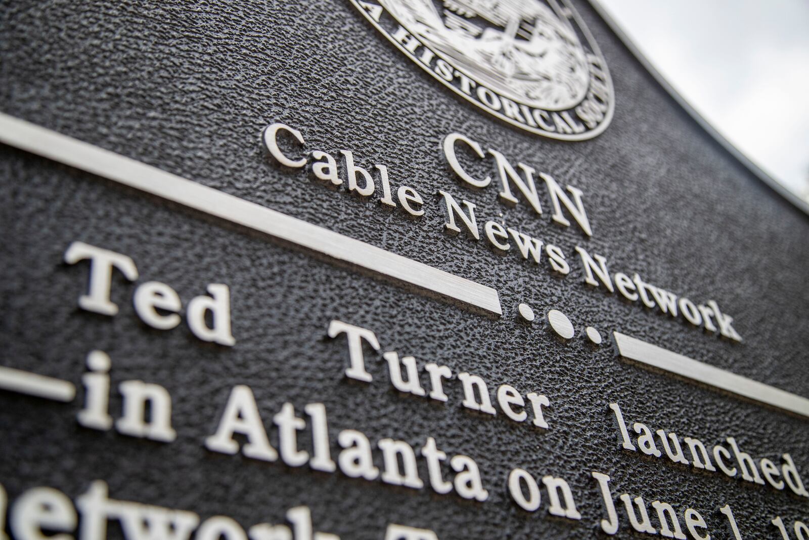 05/17/2021 — Atlanta, Georgia — A historical marker about the creation of CNN was erected in downtown Atlanta in 2021. CNN announced in 2023 that it would move to Midtown, its current location. (Alyssa Pointer / Alyssa.Pointer@ajc.com)