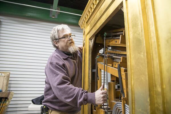 Marc Conley worked for the late Joe Patten, the “Phantom of the Fox,” and was on hand in the 1990s the last time the console was lifted from its elevator at the Fox Theatre. Now a production supervisor at Schlueter, Conley was on hand when the Mighty Mo was hoisted again. “I never thought I’d do this twice in one life,” he said. (ALYSSA POINTER/ALYSSA.POINTER@AJC.COM)