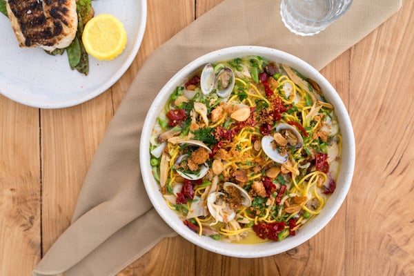 Spaghetti a la Chitarra with little neck clams, sweet peas, lardons, beurre fondue, and bread crumbs. Photo credit- Mia Yakel.