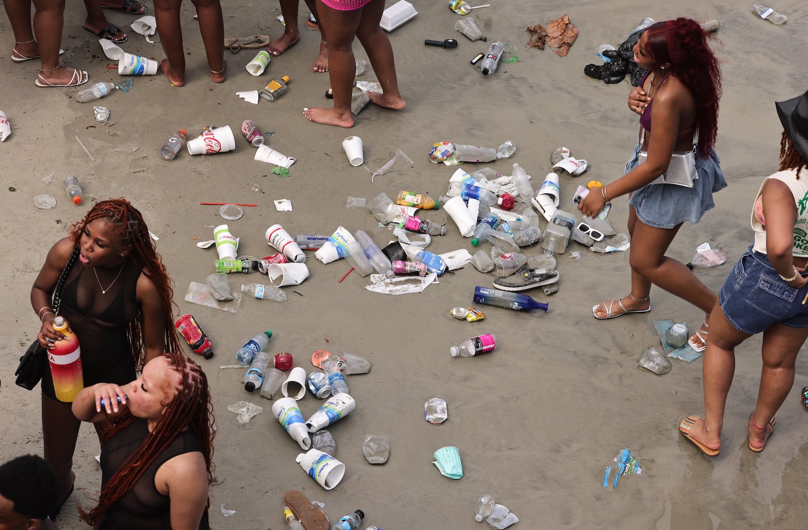 Tybee officials reported picking up enough trash on the beach Saturday to fill more than 10 all-terrain vehicles carts. (Natrice Miller/ AJC)