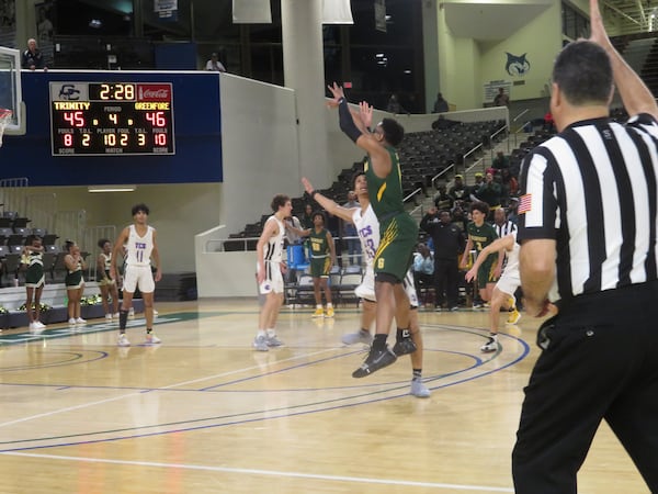 Jalen Forrest of the Greenforest Eagles attempts a 3-point basket during their Class A Private semifinal game against the Trinity Christian Lions on Friday, Feb. 28, 2020 at Georgia College and State University's Centennial Center in Milledgeville. (Adam Krohn for the AJC).