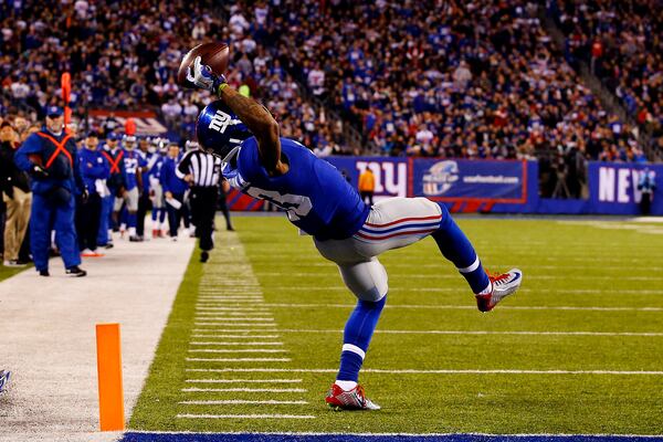 EAST RUTHERFORD, NJ - NOVEMBER 23: Odell Beckham #13 of the New York Giants scores a touchdown in the second quarter against the Dallas Cowboys at MetLife Stadium on November 23, 2014 in East Rutherford, New Jersey. (Photo by Al Bello/Getty Images)