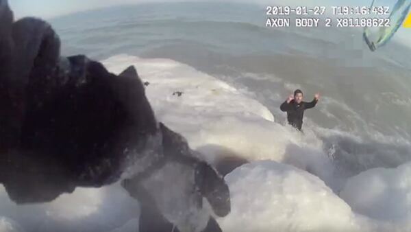 Police used a dog leash to rescue a man from frozen Lake Michigan.