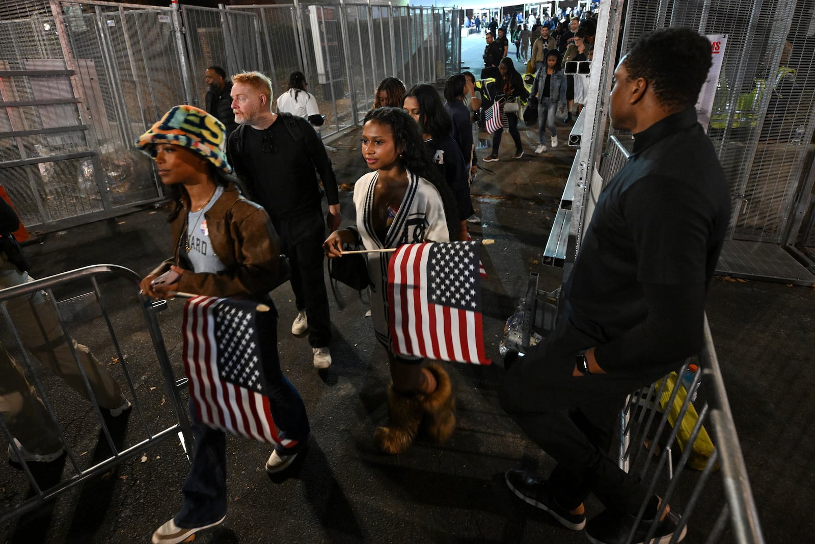 Attendees leave Democratic presidential nominee Vice President Kamala Harris' election night watch party at Howard University, Tuesday, Nov. 5, 2024, in Washington. (AP Photo/Terrance Williams)