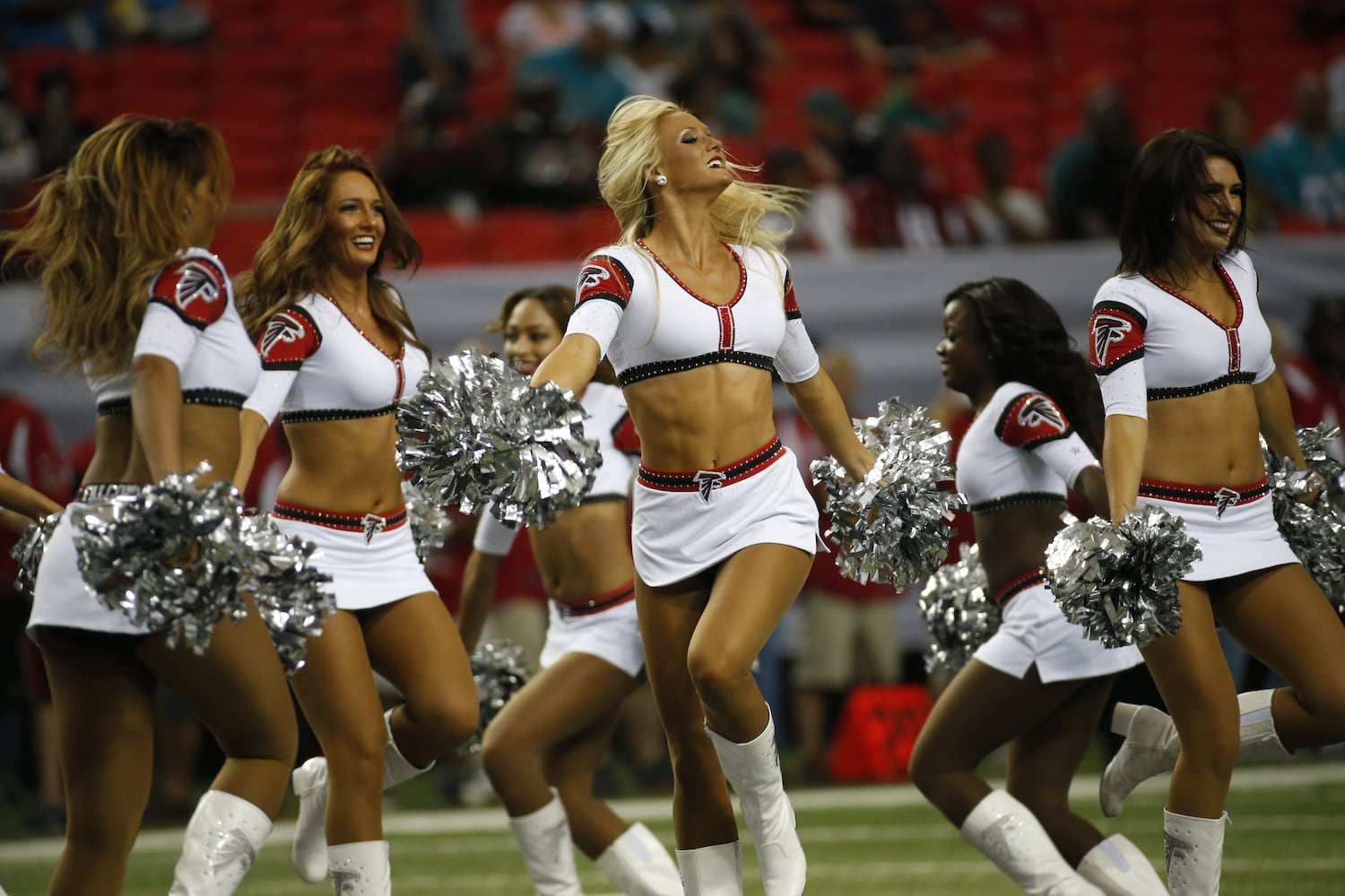 NFL cheerleaders perform at preseason games