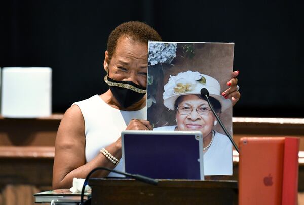 Gwendolyn Payton holds a photograph of her late mother, Johnnie Mae Middleton, as she speaks during the artist talk for her new gallery exhibition, “The Faith of the Dreamer: Opposition to the Truth May Derail the Dream but the Faith of the Dreamer Prevails," at Plunkett Gallery in the Hardman Hall Fine Arts Building at Mercer University in Macon on Friday, Sept. 25, 2020. Payton's mother supported her educational efforts, and before she died in April, she knew her daughter's long-delayed exhibit was finally going to happen. Hyosub Shin / Hyosub.Shin@ajc.com