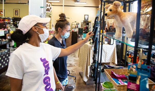 Domonique Steele (L) and Cassidy Heflin look over the dog supplies at Pooch N Paws in Suwanee on August 10, 2020. STEVE SCHAEFER FOR THE ATLANTA JOURNAL-CONSTITUTION