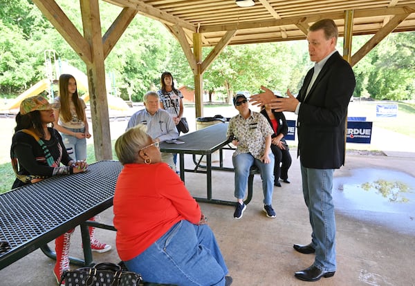 May 5, 2022 Hoschton - Former U.S. Sen. David Perdue talks to his supporters at a campaign event at Sell's Mill Park in Hoschton on Thursday, May 5, 2022. (Hyosub Shin / Hyosub.Shin@ajc.com)