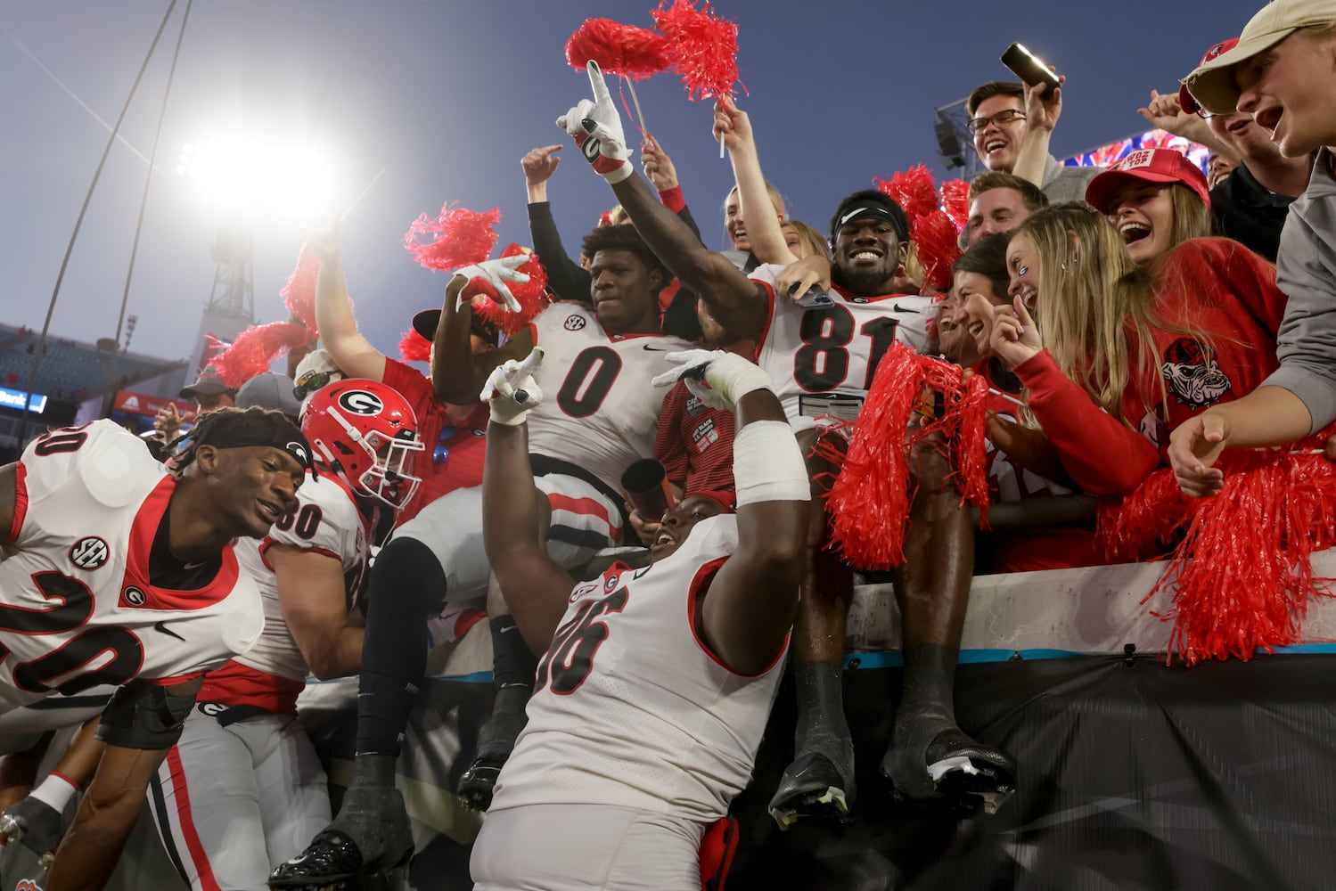 10/30/21 - Jacksonville - Georgia players celebrate with fans after the annual NCCA  Georgia vs Florida game at TIAA Bank Field in Jacksonville. Georgia won 34-7.  Bob Andres / bandres@ajc.com