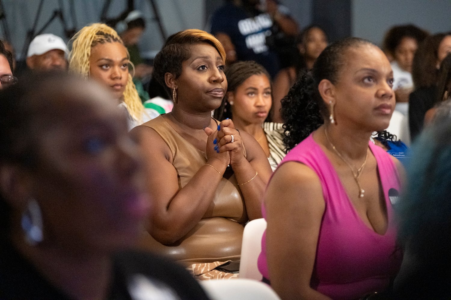 Danielle Tuwano, Communication Director for the Gwinnett Young Democrats listens to Vice President Kamala Harris’ acceptance speech during a watch party at The Gathering Spot in Atlanta on Thursday, Aug. 22, 2024.   (Ben Gray / Ben@BenGray.com)