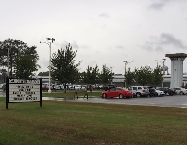 A sign set up outside Georgia State Prison in Reidsville offers job opportunities. Turnover and staffing shortages are constant problems in the prison system. JOHNNY EDWARDS / JREDWARDS@AJC.COM