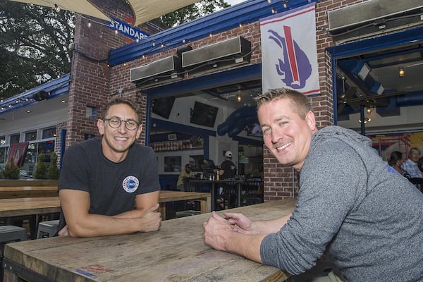 6/20/2019 — Roswell, Georgia —The Standard Bar and Grill business partners Dallas Bond(right) and Jason Chaifetz(left) sit for a portrait at their restaurant in downtown Roswell, Thursday, June 20, 2019. (Alyssa Pointer/alyssa.pointer@ajc.com)