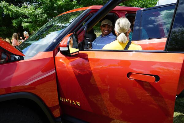 Loganville resident Tony Wahab sits in a Rivian R1T electric truck at a community appreciation event hosted by Rivian on Perimeter College's Newton County campus on Saturday, May 14, 2022.