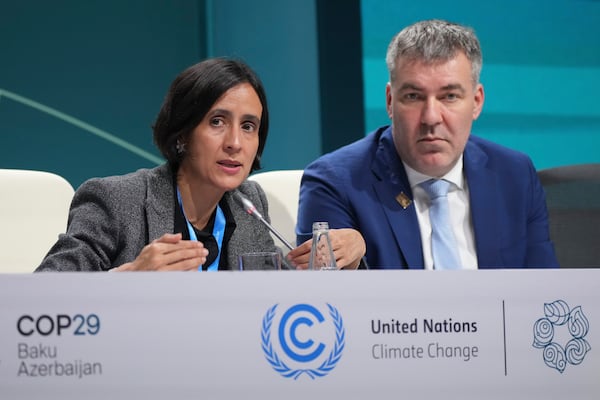 Susana Muhamad, environment minister of Colombia, left, speaks at a session next to Denmark Climate Minister Lars Aagaard during a session at the COP29 U.N. Climate Summit, Thursday, Nov. 21, 2024, in Baku, Azerbaijan. (AP Photo/Sergei Grits)