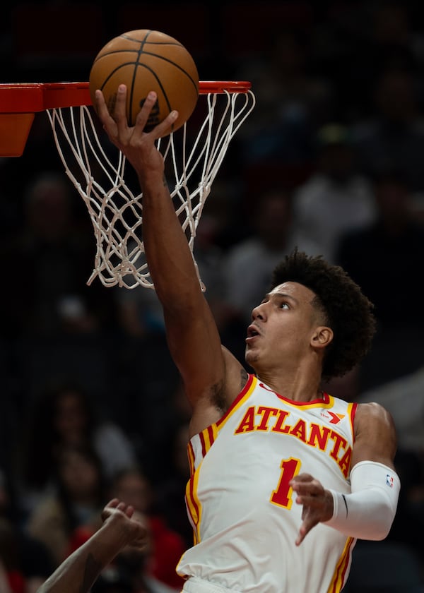 Atlanta Hawks forward Jalen Johnson drives to the basket during the first half of an NBA basketball game against the Portland Trail Blazers, Sunday, Nov. 17, 2024, in Portland, Ore. (AP Photo/Jenny Kane)