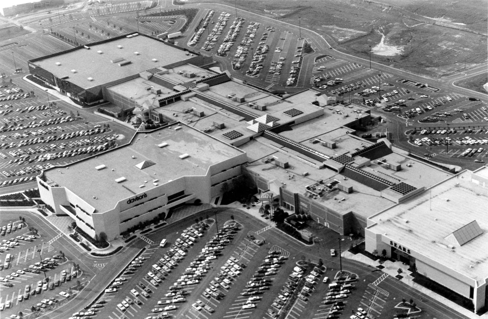 Gwinnett Place mall, shown here an early but undated aerial photo, opened near Duluth in 1984 after a big party. Shoppers who were headed to the mall backed up traffic on I-85 for two miles.