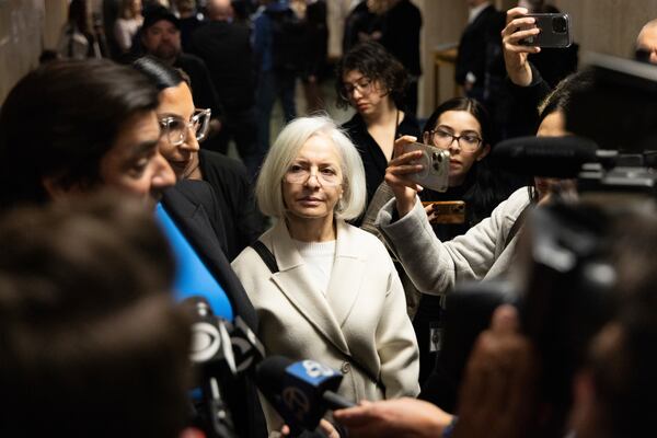 Mahnaz Tayarani, the mother of Nima Momeni, stands at the Hall of Justice during the murder trial of Nima Momeni, Tuesday, Dec. 17, 2024, in San Francisco. (AP Photo/Benjamin Fanjoy)