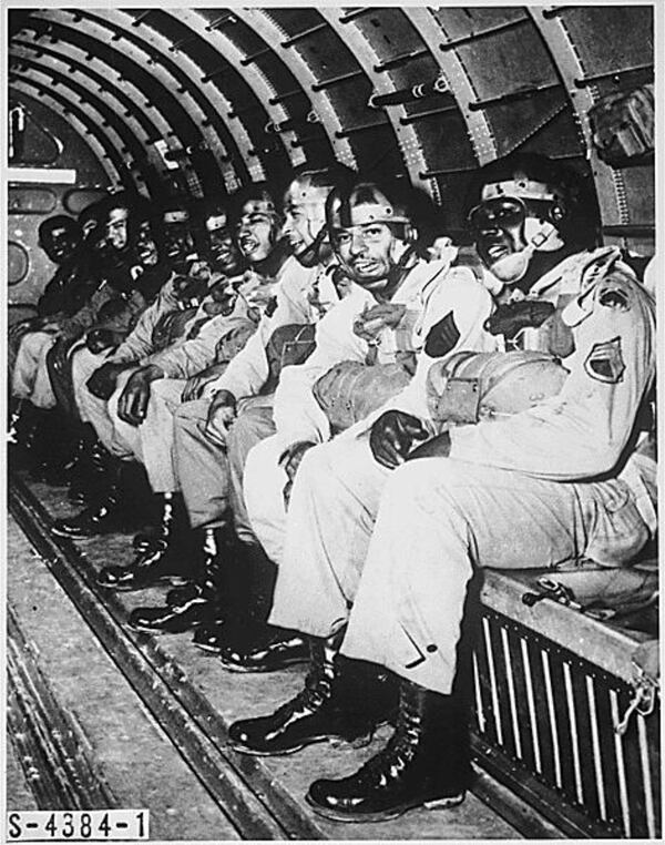 Clarence H. Beavers (second from right) was among the soldiers on a C-47 transport at Fort Benning in this March 1944 photo. The soldiers were preparing to make one of the five required qualifying jumps to become paratroopers. (National Archives)