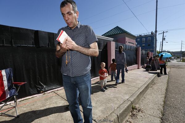 An abortion opponent prays outside the Jackson Women’s Health Organization clinic in Jackson, Mississippi. It is the only medical facility that performs abortions in the state. The state Legislature recently passed a law that would ban most abortions after a fetal heartbeat is detected, meaning as early as six weeks. Similar legislation has also won passage in Georgia. (AP Photo/Rogelio V. Solis)