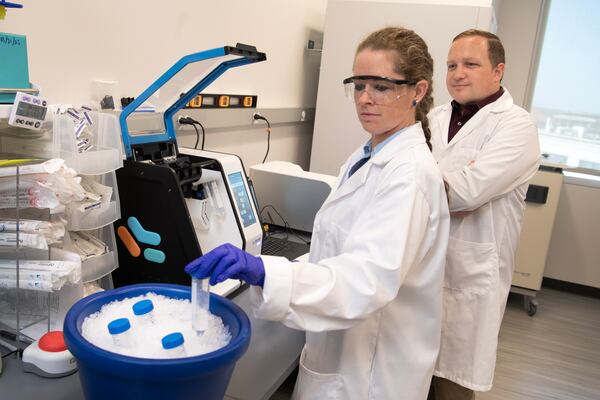 Loren Sasser (left) and Darryl Vanover (right) working in the Santangelo Lab.  
Emory researchers will be part of a collaborative effort to identify new mRNA drugs to enhance the body's immune response.
Photo credit: Jack Kearse