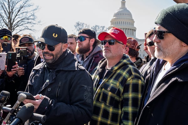 Former Proud Boys leader Enrique Tarrio, left, speaks at a news conference at the U.S. Capitol in Washington, Friday, Feb. 21, 2025, with Joseph Biggs, second from right. (AP Photo/J. Scott Applewhite)